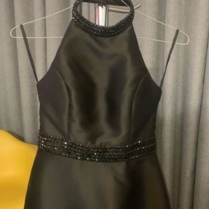 Beautiful black dress  with neckline on the back.